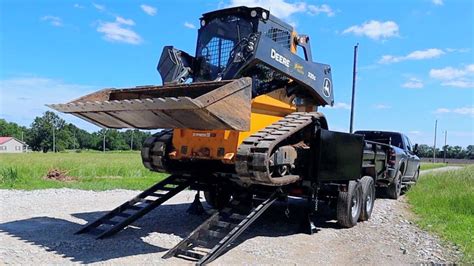 how to load a skid steer on a gooseneck trailer|how to load a skid steer.